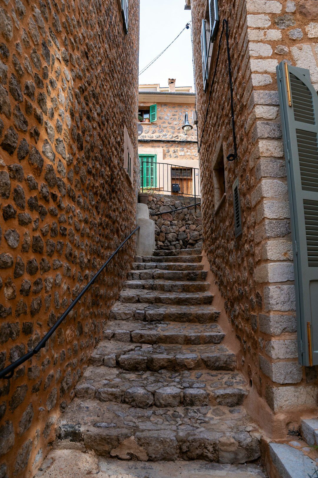 Narrow stone alley with stairs in an old town