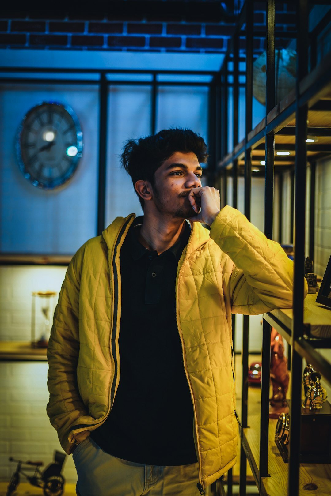 Latino man talking on the phone indoors