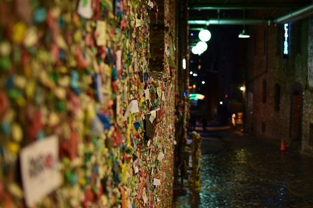 Colorful street art mural on a city wall at night