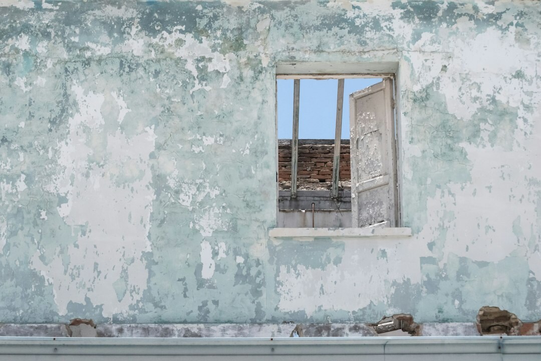 Decaying old building facade with faded paint