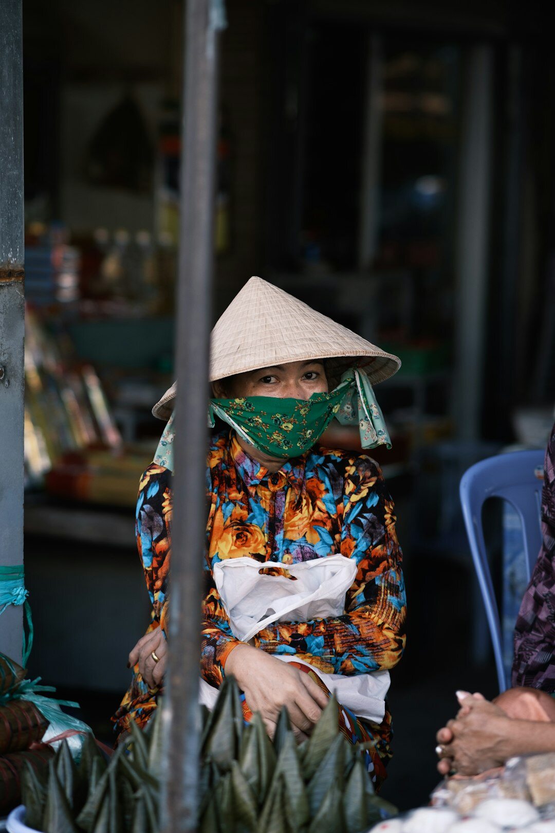elderly woman selling food